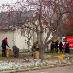 SCA Students collecting the leaves in the backyard